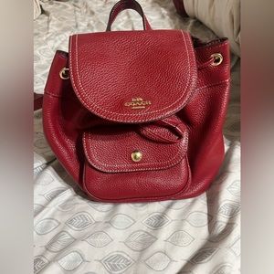 Red leather Coach backpack purse with gold detailing. Used a few times.
